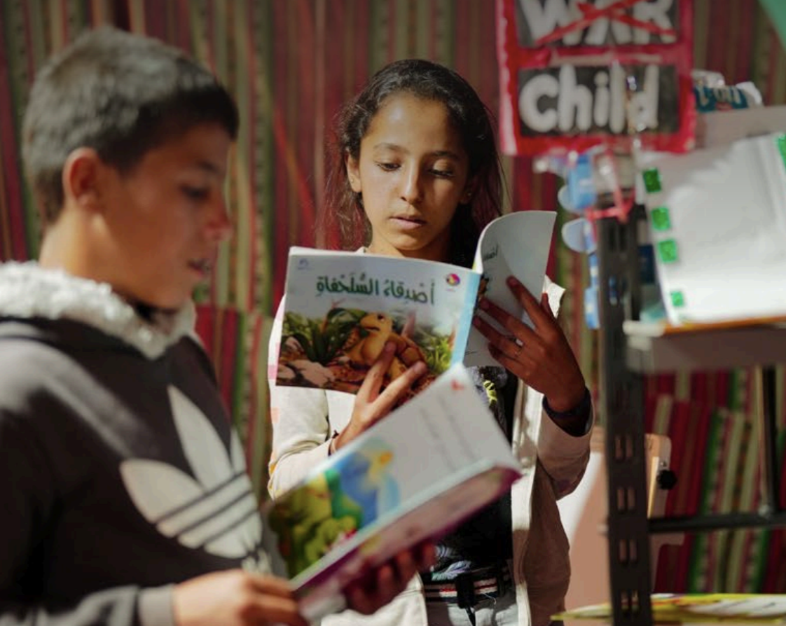 Children reading storybooks together